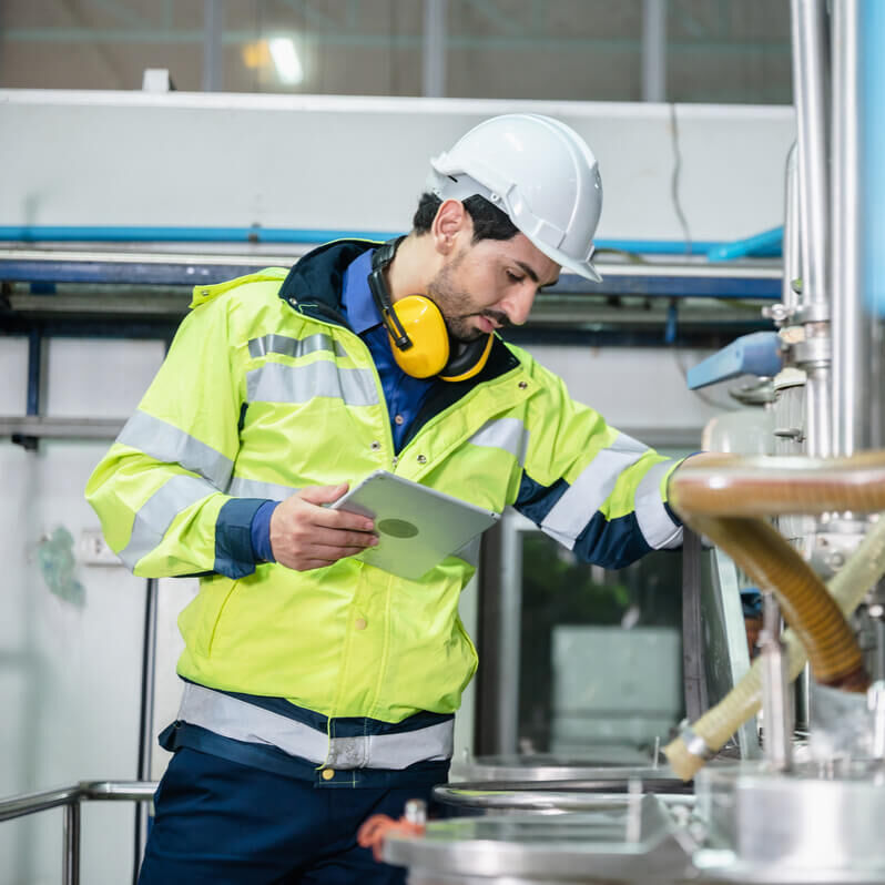 Male employee in protective clothing at sustainable chemical company