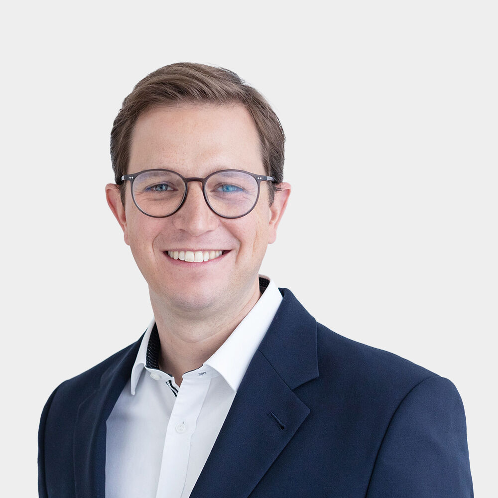Martin Christopher Portraitfoto von Martin Christopher vor grauem Hintergrund