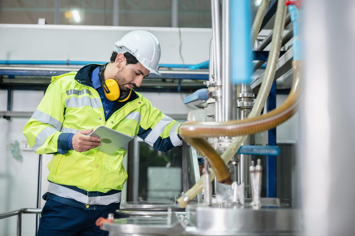 Male employee in protective clothing at sustainable chemical company