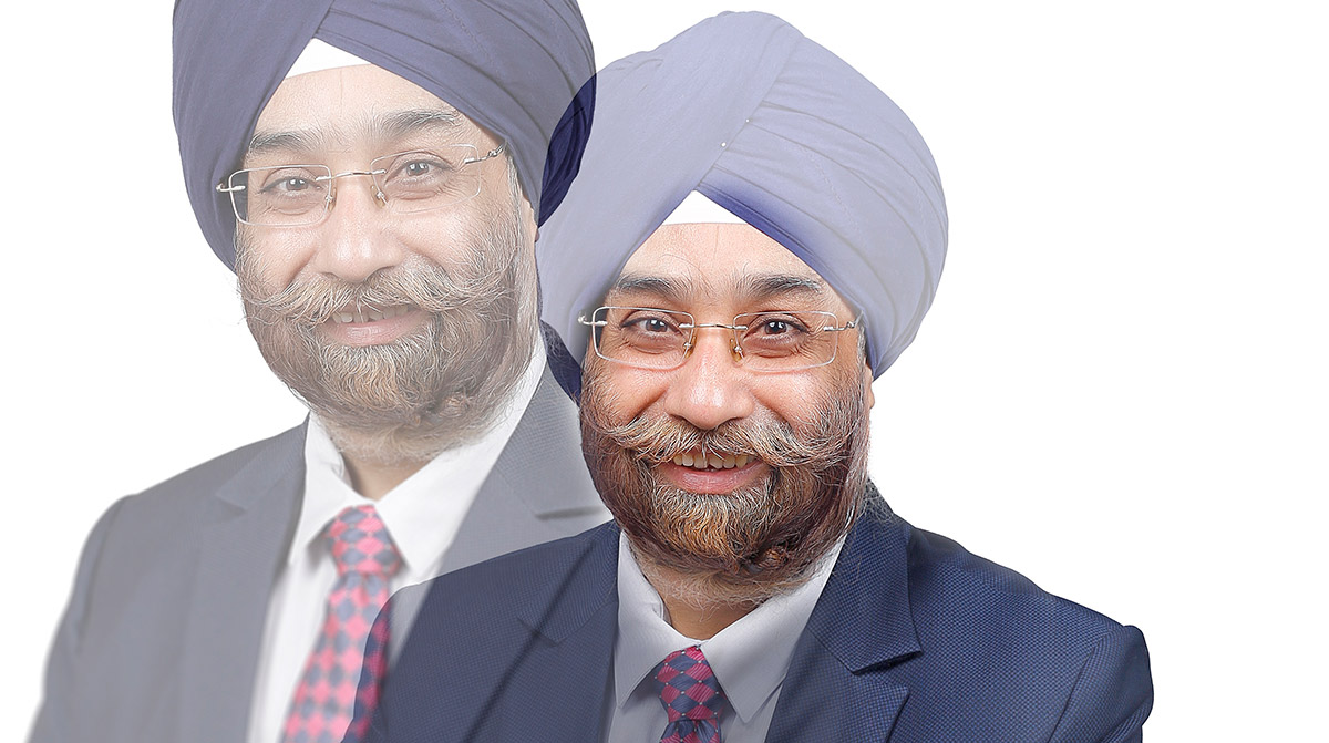 A portrait of Rajinder Singh that has an overlay effect.