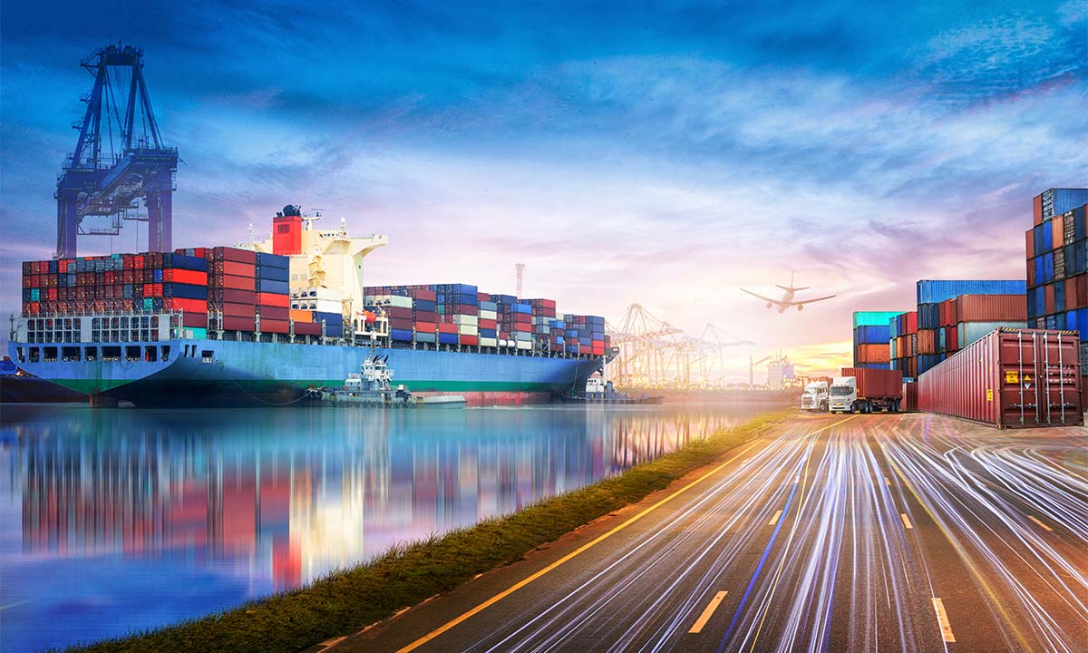 A container port with a cargo ship being loaded by a cargo crane.