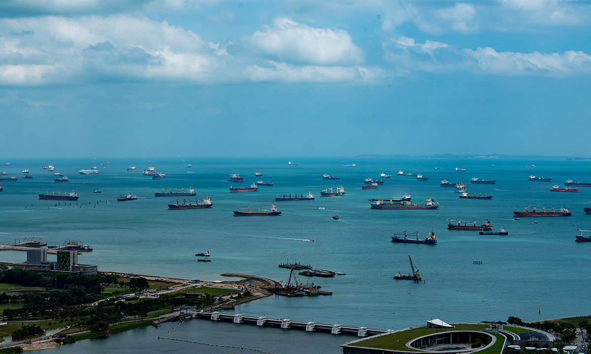 Many container ships lie waiting off the coast of China.